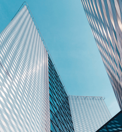Bottom-up view of an angular office building.