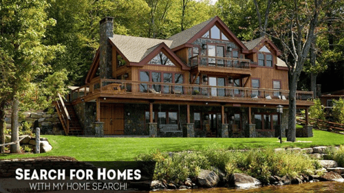 large brown home on the water