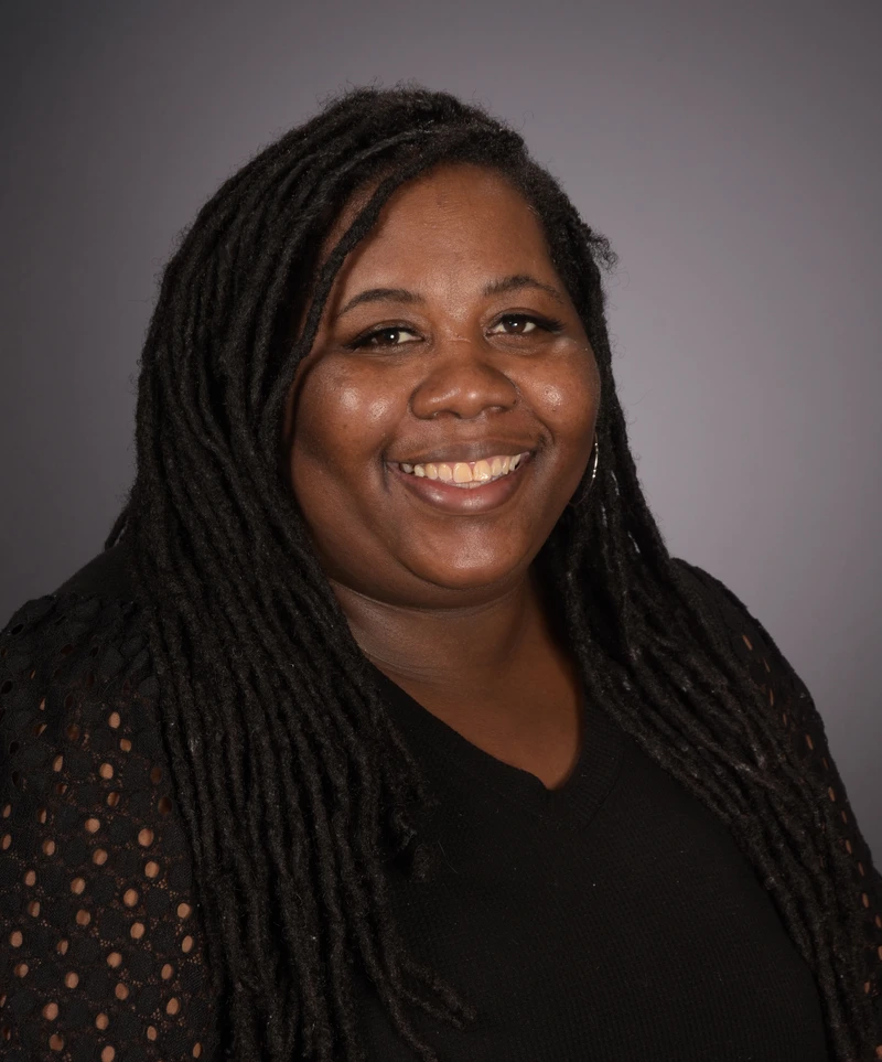 Headshot of School Director Tway Thomas