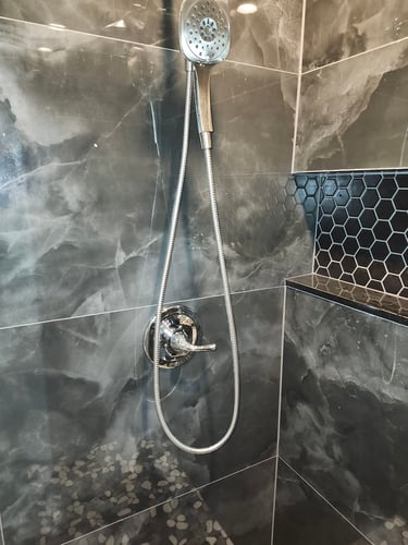 A recently repaired shower faucet, now leak free.