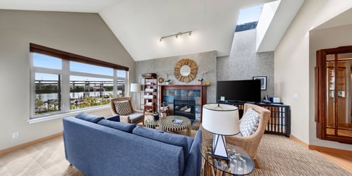 Full kitchen, living room with fireplace, dining area and balcony