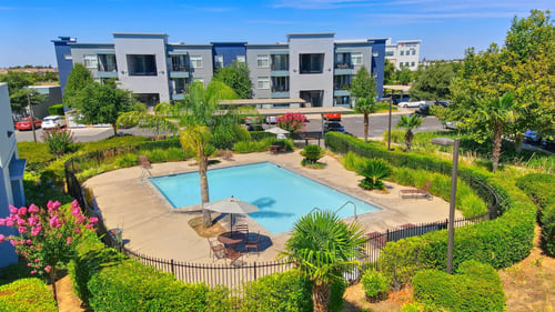 Apartment complex with pool at The Ridge Apartments, Elk Grove, CA