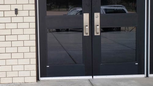 business with a security system installed at front door