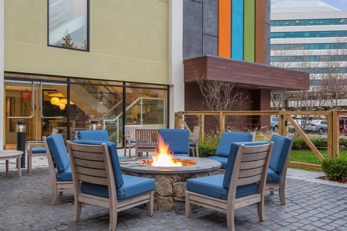 Relax with friends and family by the fire on our patio.