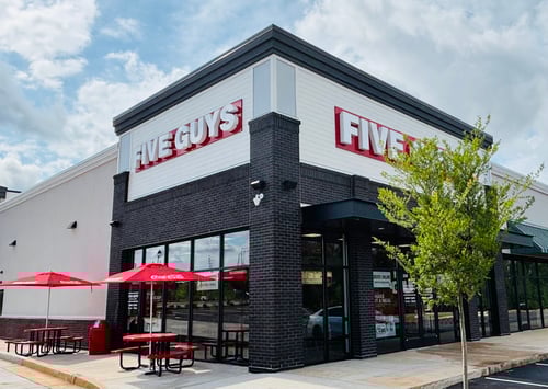 Exterior photograph of the Five Guys restaurant at 1060 Chen Parkway in McDonough, Georgia.