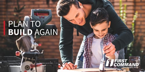 Photo of a father and his son working.