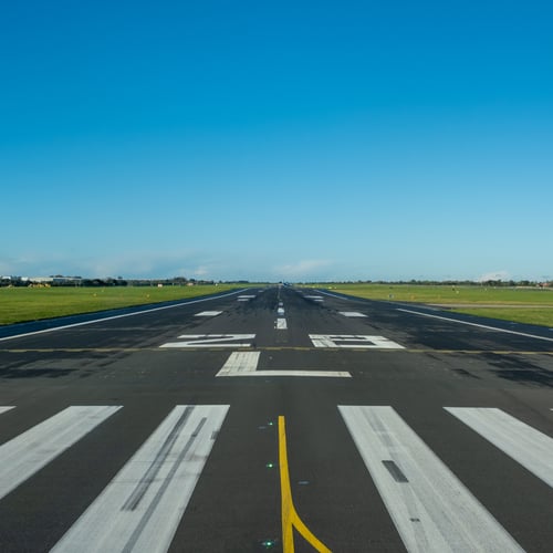 Sweeper cleaning an airport runway