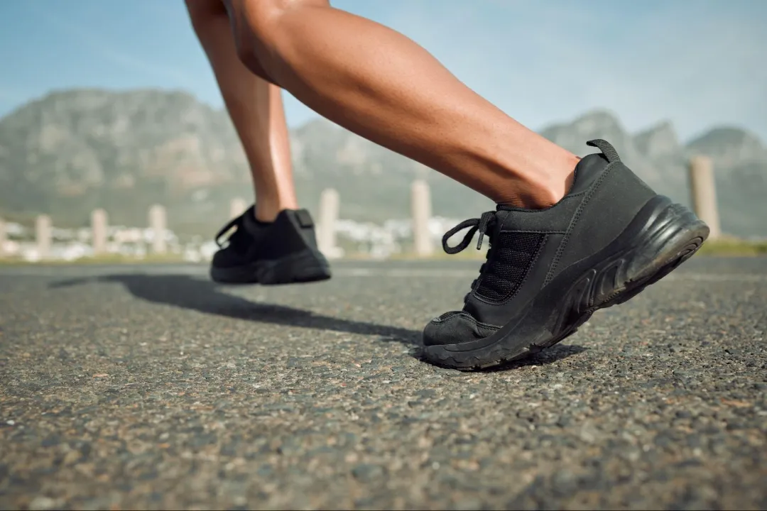 close up of shoes and legs of a runner