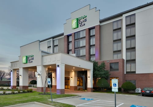 The exterior of a hotel in Irving, TX, near Toyota Music Factory.