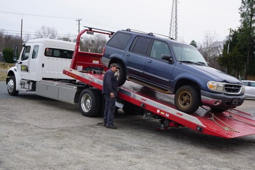 Vehicle repair technician working on a car in Fredericksburg