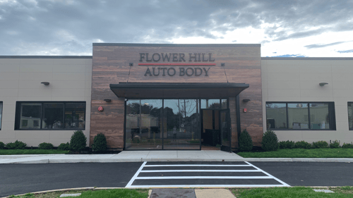 Exterior view of Flower Hill Auto Body in Huntington, NY, A Modern collision repair
shop with clean signage, a well-maintained building, and professional curb appeal, trusted by Suffolk County drivers for expert auto body and paint services.
