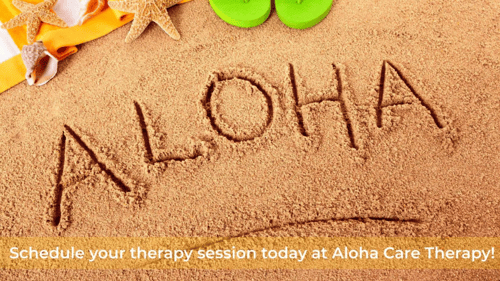 Aloha written into sand