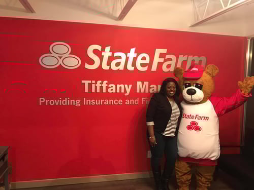 Agent Tiffany and Neighbear standing and smiling together in office