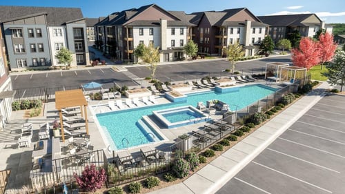 An aerial view of the apartment complex with a swimming pool at The Quarry, Fort Collins, CO 80526