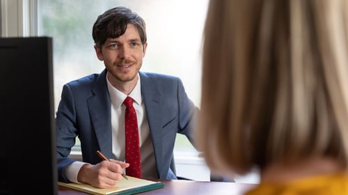 Alex Weatherby speaking with a client