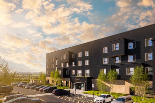 Hotel exterior made of solar panels and timber cladding