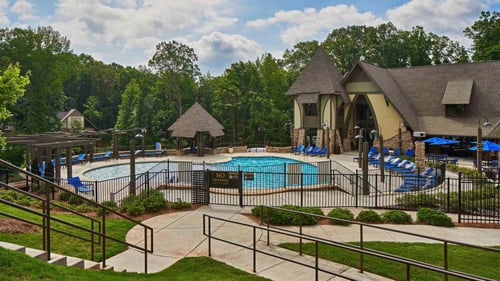 Large resort-style pool with ample deck space and seating.