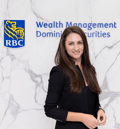 A photo of Claudia Oroianu in front of the RBC Dominion Securities sign.