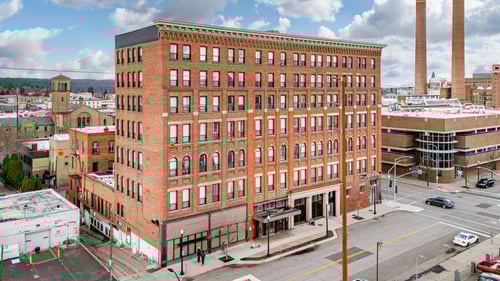 A large red brick building with a parking lot in front at 206 Flats, Spokane, Washington, 99201