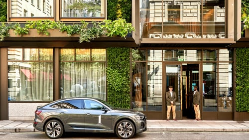 Exterior of 1 Hotel Mayfair with Electric Audi House Car.