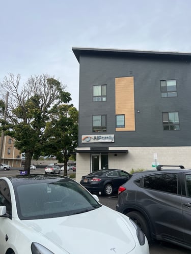 Exterior street-level shot of the modern All Family Vision Care medical eye care clinic building
