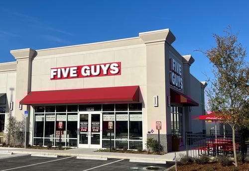 Exterior photograph of the Five Guys restaurant at 1838 N. Lecanto Highway in Lecanto, Florida.
