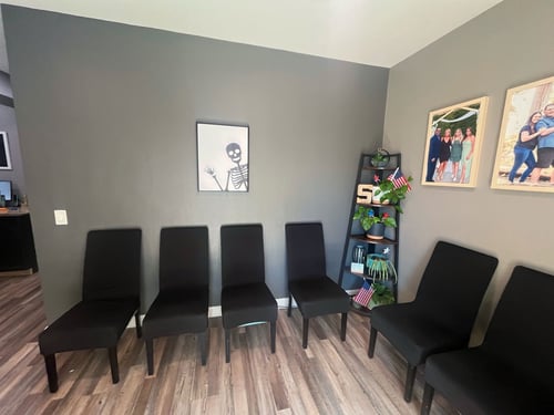 Comfortable and clean waiting area at Simon Chiropractic where patients relax before their chiropractic appointments.