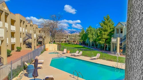 Sparkling Swimming Pool with fence at Pavilions at Pantano Apartments, Tucson
