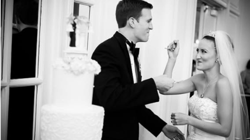 Couple Eating Wedding Cake