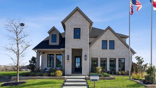 Exterior of the Normandy Homes model home at Watson Branch in Mansfield, TX.