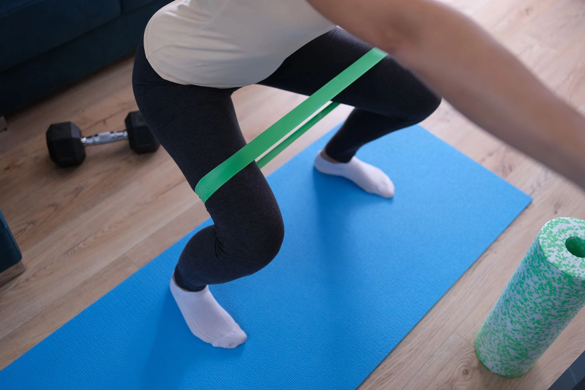 person stretching to improve kinetic chain and heal knee pain