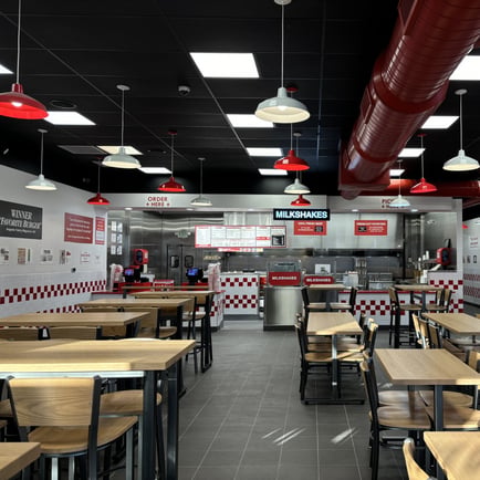 A photograph of the remodeled dining room and kitchen ahead of the reopening of the Five Guys restaurant at 4324 Washington Road in Evans Georgia.
