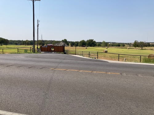 If you driving up to the Cleburne location, this is what you'll see when you arrive. Our wooded gate with the CA logo across.
