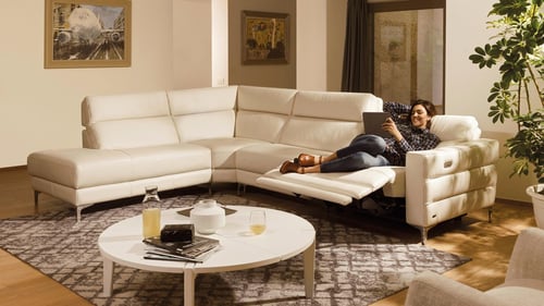 white couch in a white family room