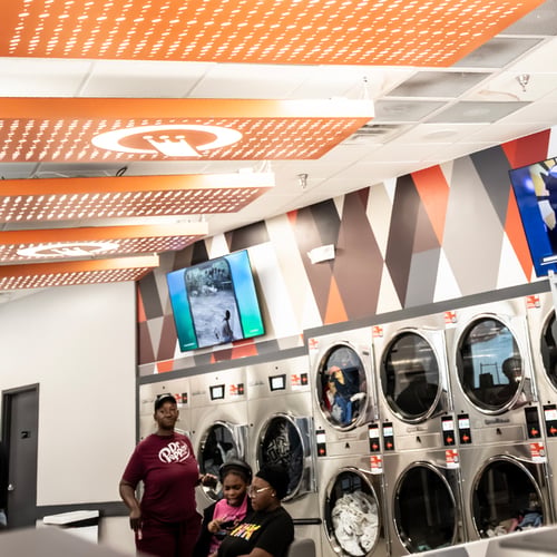 Bright Speed Queen Laundry interior with commercial washers and dryers
