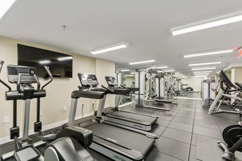 Fitness Center with cardio and elliptical equipment at Carver and Slowe apartments in Washington 20001