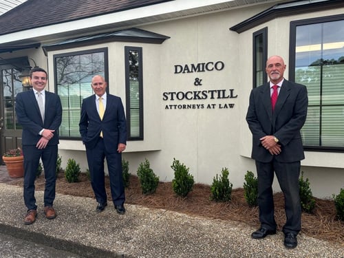 Damico & Stockstill criminal lawyers standing in front of their office building