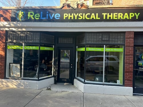 “Storefront of ReLive Physical Therapy in Bloomingdale, IL with large front windows, bright green signage, and a glass entry door.”