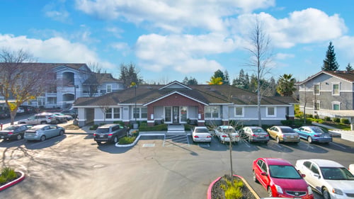 Property management office with front parking lot at Geneva Pointe Apartments, California