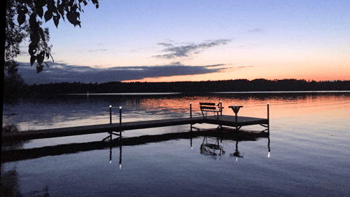 dock in the water during sunset