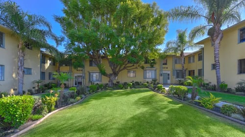 apartment complex with outdoor space at Acclaim at Baldwin Village, Los Angeles, CA