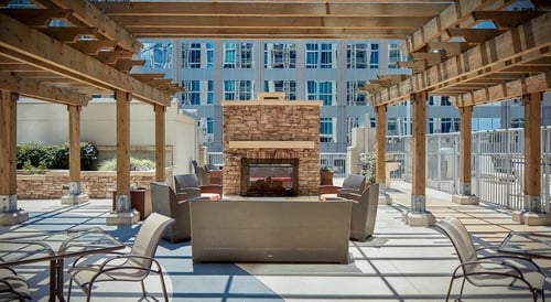 Outdoor terrace with fireplace and ample cabana seating.
