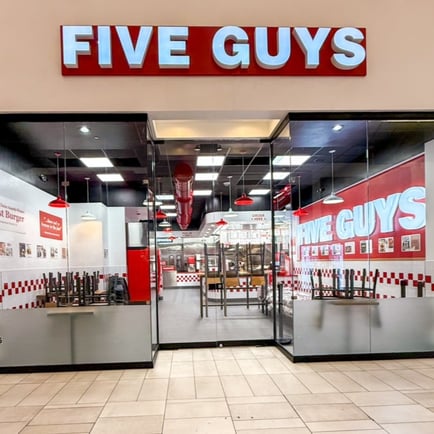 Exterior photograph of the Five Guys restaurant inside Sawgrass Mills mall in Sunrise Florida.