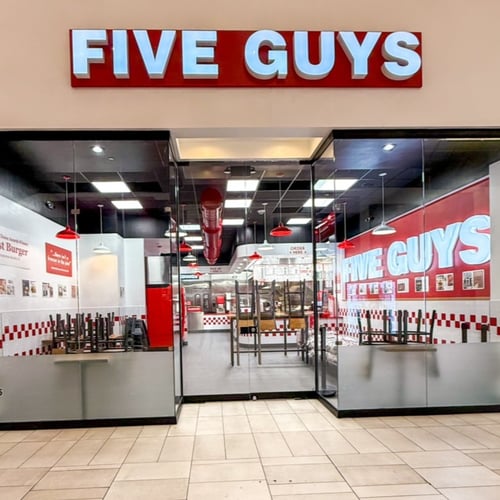Exterior photograph of the Five Guys restaurant inside Sawgrass Mills mall in Sunrise Florida.