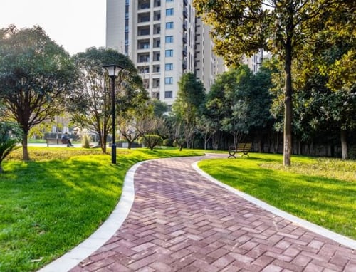 commercial maintenance for a landscape with garden and a driveway