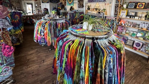 Inside of the The Peace Place: Peace Addict Tie Dyes storefront