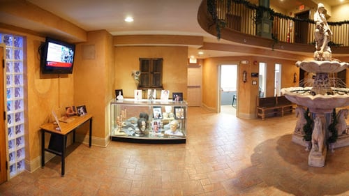 interior of large room with yellow walls and tile floor