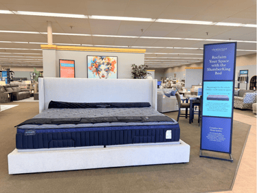 The Slumberking Mattress. It is 3 feet wider than a traditional king mattress. Perfect for co sleeping families with kids and pets. Only at Slumberland Furniture Burlington.