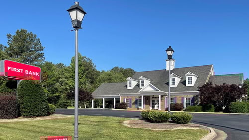 First Bank Troy Branch exterior showing signs.