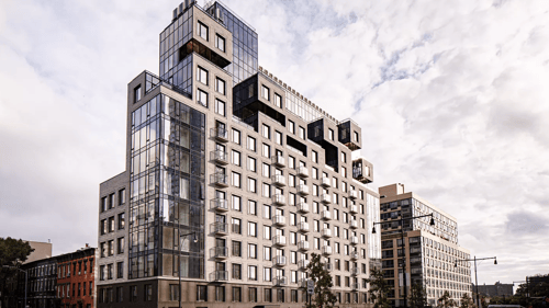 Modern apartment building exterior with geometric architecture at 260 Gold Apartments, Brooklyn, New York